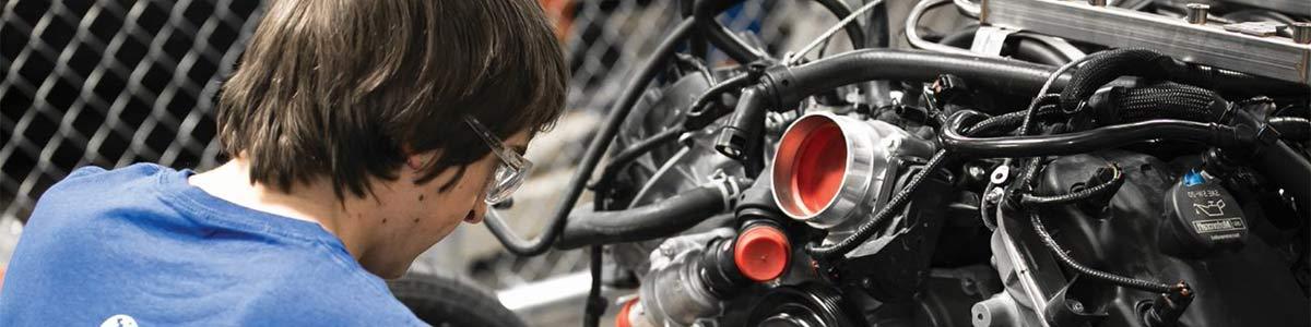 A student working on an engine