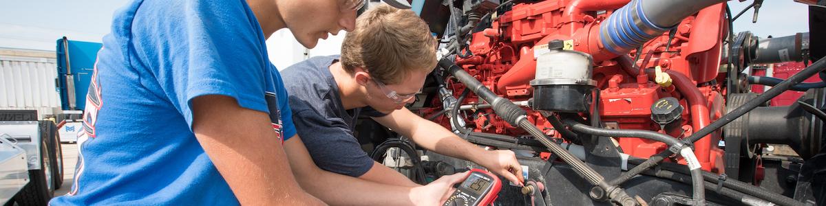 Diesel Technology Students working on a engine